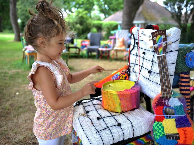 East Preston Yarnbombers have created an enchanting picnic area with chairs that are beautifully-decorated knitted masterpieces