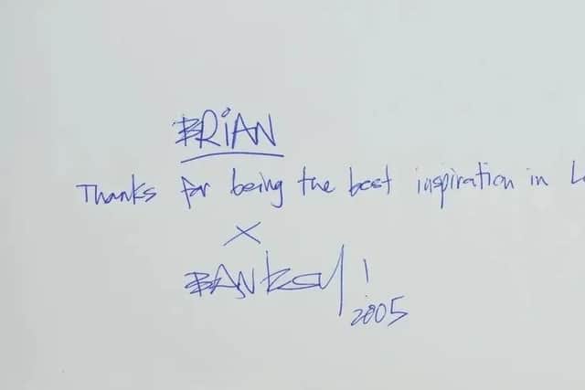 Inside the cover of the book, the inscription reads: "Brian. Thanks for being the best inspiration in London. Banksy, 2005." Picture: Eastbourne Auctioneers