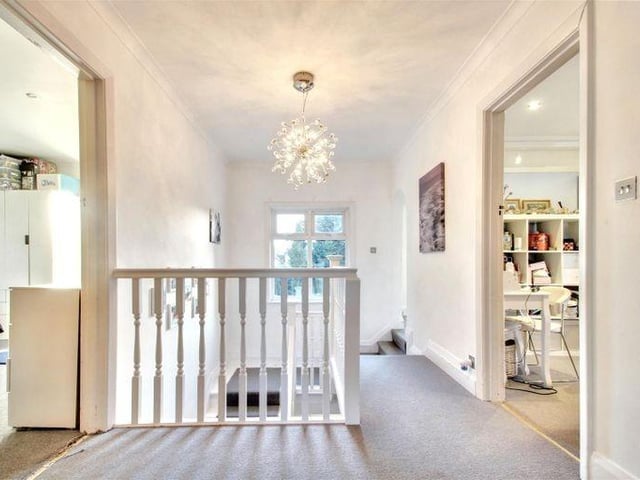 Upstairs, there is a spacious landing