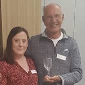 Mike Shaw with Worthing Samaritans director Fiona Cameron and the engraved goblet to mark his 50th year as a listening volunteer