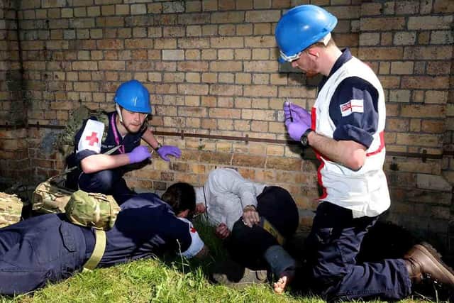 Pictured: Medics and first aiders help a casualty during a disaster relief exercise (CROWN COPYRIGHT) Credit: LPhot Dan Rosenbaum RNAS Yeovilton