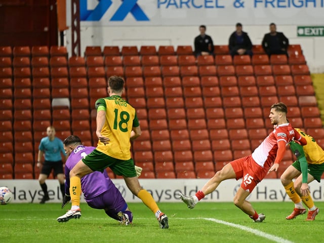 John McAtee of Barnsley scores but it is ruled offside during the Emirates FA Cup First Round match between Barnsley and Horsham at Oakwell Stadium.