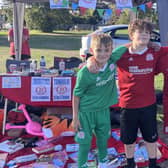 The Worthing Dynamos U11 team ran a set of challenges, including throwing wet sponges at people in stocks, at BroadFest. Picture: Amber Henty