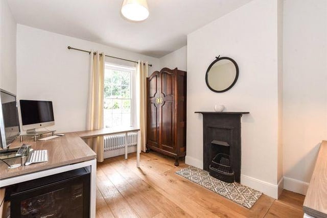 The property retains many period features including sash windows, doors, fireplaces and exposed flint brickwork.