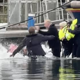 Still from footage depicts James Corden falling into water whilst filming in Eastbourne's Sovereign Harbour. // James Corden falls into the harbour filming for new Apple TV comedy series 'The Choir' with Ruth Jones.