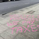 Graffiti seen in Chichester on Saturday, April 6, urging West Sussex County Council to fix several large potholes