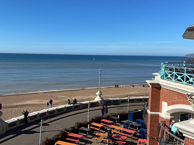 Police officers have taped off a section of Brighton beach after the discovery of a 'suspected mine'