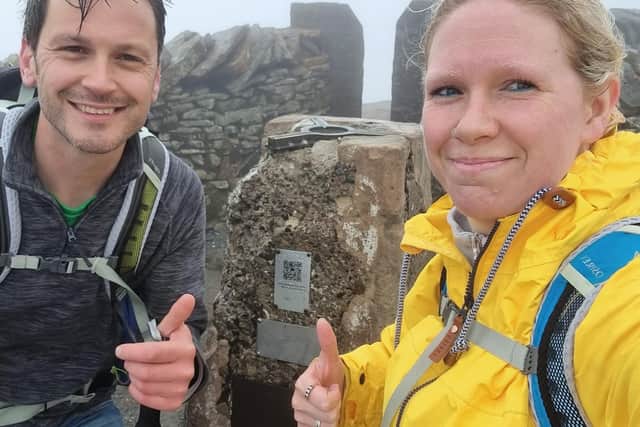 Ali Durrant and her husband Ben at the top of Whernside in the rain. Picture: Macmillan Cancer Support