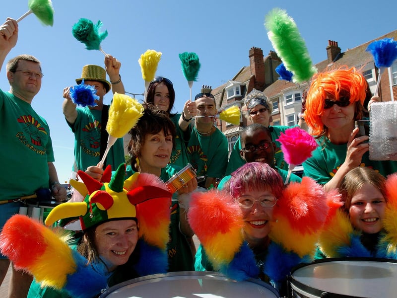 Celebration Samba playing with feather dusters in Montague Street, Worthing, in 2008