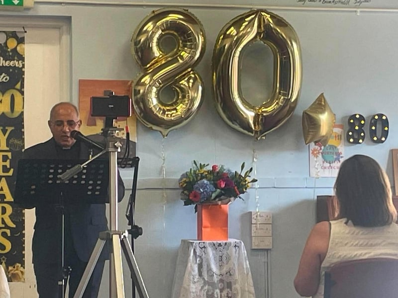 The Rev Gadalla Tiab speaking at the 80th anniversary service