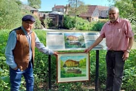 Holding the painting in front of the new interpretation panel is artist David R G Johnston and Tony Sneller, a trustee of The Coultershaw Trust.