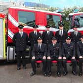 New recruits pictured with the service's training instructors