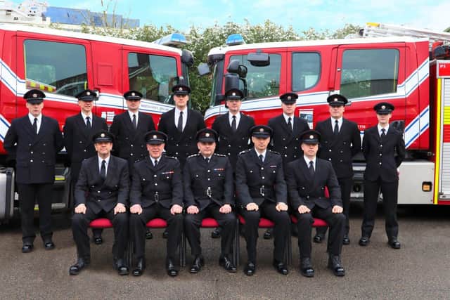 New recruits pictured with the service's training instructors