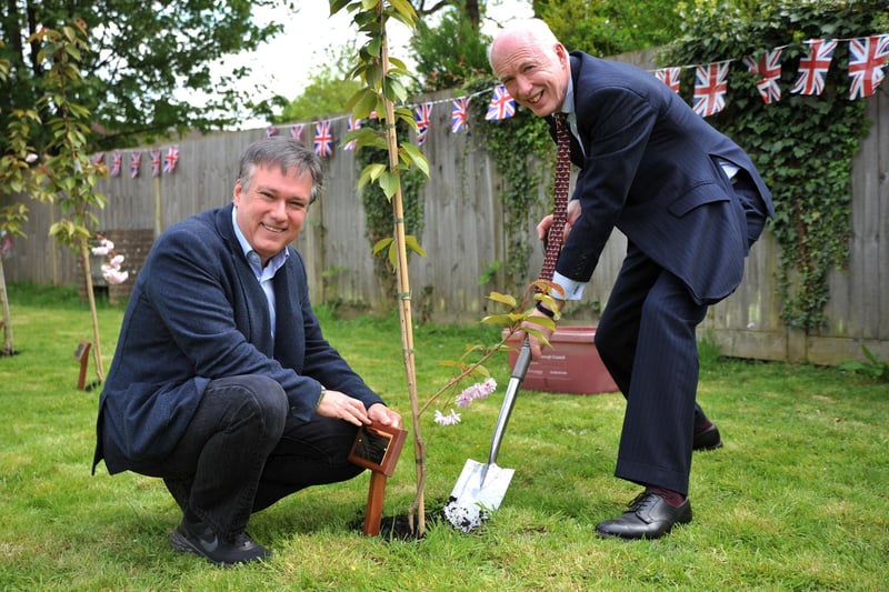 Henry Smith MP and Andy Bliss QPM The High Sheriff of West Sussex at the official commemoration of three cherry trees at Crawley Hospital. Pic S Robards SR2305041