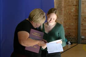 A student shares her results with family.