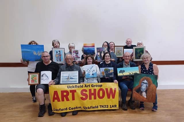 Members of the Uckfield Art Group prepare for the 11 November show.