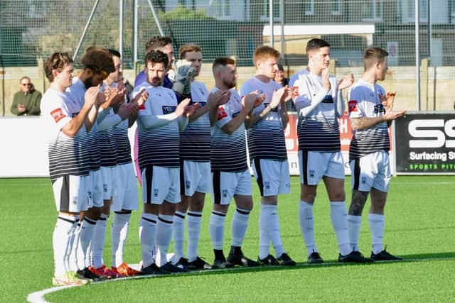 Littlehampton Town's players join a minute's applause as a mark of respect for Pele, who died last week | Picture: Stephen Goodger