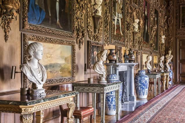 The Carved Room, with the four paintings by Turner restored to the panelling, at Petworth House and Park, West Sussex. The carvings are by Grinling Gibbons. Henry VIII portrait hangs over fireplace. ©National Trust Images/Andreas von Einsiedel