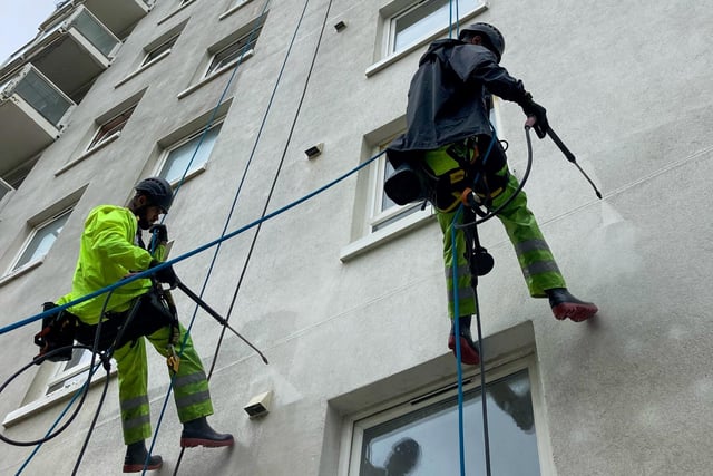 The team from Spectrum Specialist Support descended the walls of Four Courts in St Leonards, spending several weeks cleaning the exterior. Picture from Optivo