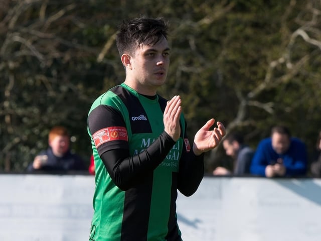 Burgess Hill Town players, fans and staff celebrate surviving in the Isthmian south east division at the end of their 0-0 draw with Beckenham