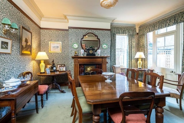 The formal dining room has French doors leading into the rear garden