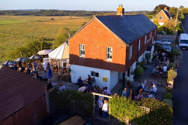 The Sportsman in Amberley hosted a party with free burgers on Saturday, August 22, to celebrate it becoming community owned
