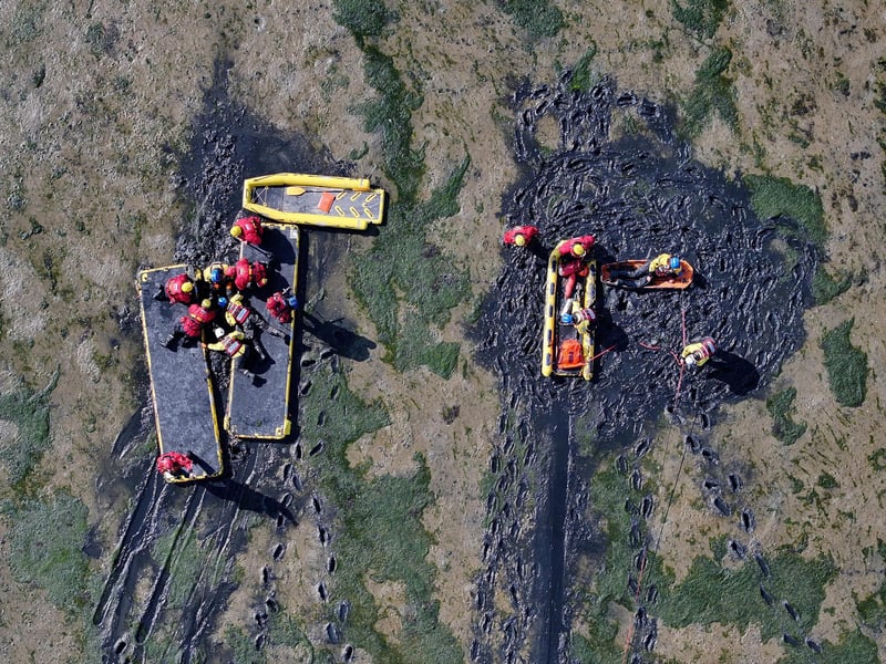 Both agencies worked together to rescue casualties from mud.