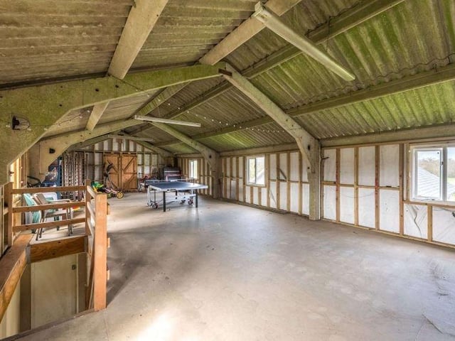 The barn is a large detached building with an open bay car port and workshop on the ground floor, and a first floor currently used as a games room. There is a further detached outbuilding, comprising a garden room/office and a further boot room, both with heating, and an open bay car port
