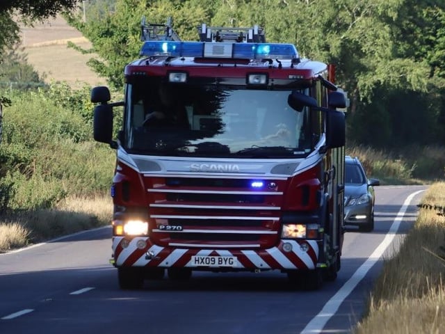 Firefighters successfully extinguished a fire in a field at Upwaltham, close to the A285. Photo: Jack Chiverton