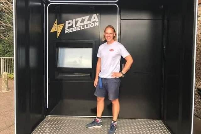 Will Jack at the Pizza Rebellion machine outside Chichester Railway Station