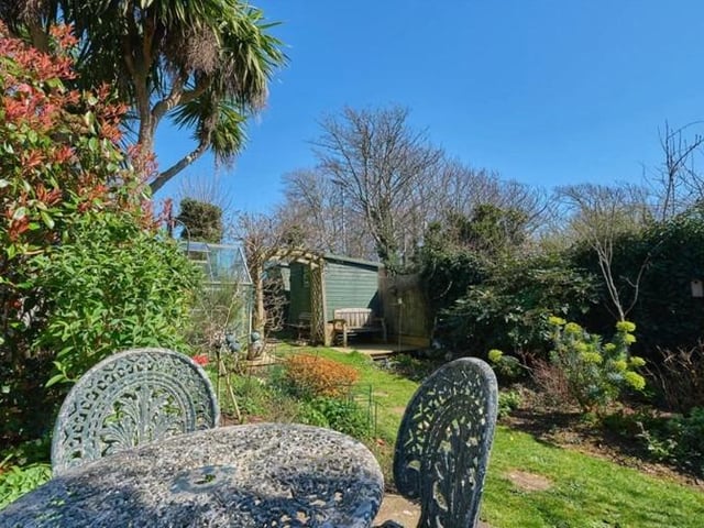 Outside the front is mainly laid to lawn with a remainder path leading to the front door. The attractive rear garden is approximately 80ft in length being lovingly landscaped and laid out with a variety of seating areas to really make use of the space and seclusion.