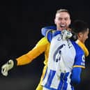 Brighton goalkeeper Jason Steele and defender Levi Colwill celebrate victory against Crystal Palace