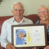 Allan and Patricia Ware with their card from the Queen.
