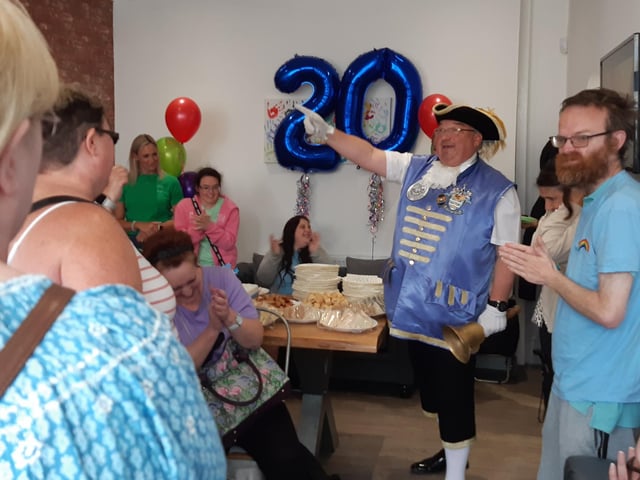 Frontline Associates Supported Tenancies celebrates the company's 20th anniversary and the first anniversary of the Frontline Hub, in Rowlands Road, Worthing, with a party for staff, service users and guests included Worthing town crier Bob Smytherman