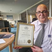 Shabbir Jafferali with his British Citizen Award medal and certificate. Picture: Elaine Hammond / SussexWorld