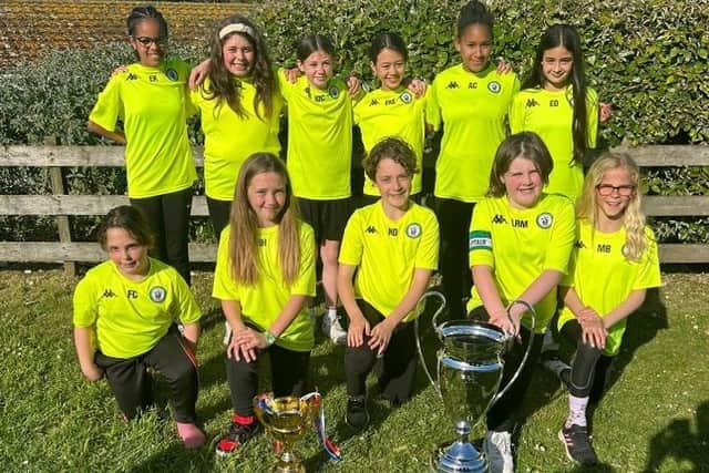 The Burgess Hill U11 girls in Cornwall with the cup