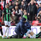 Kaoru Mitoma of Brighton & Hove Albion receives medical treatment at Sheffield United