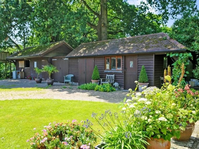 This five bed converted barn in Anmore Road, Denmead is on the market for £1.4m. It is listed on Zoopla by White & Guard Estate Agents.