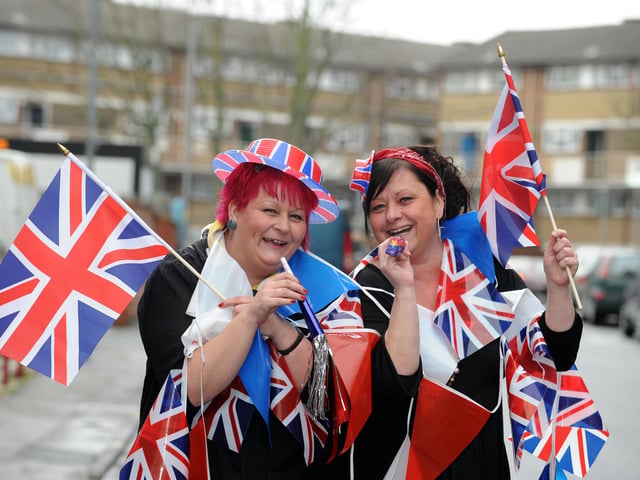 Staff from U-Need-Us (l-r) sisters Karen Knipe and Tracey Knipe get the street party started outside the store in February 2011. Picture: Allan Hutchings (110573-322)