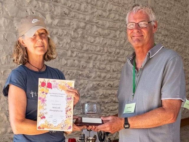 Zoe Steel receives the Derek Silk Photography Cup for best photograph from chairman Chris Hill