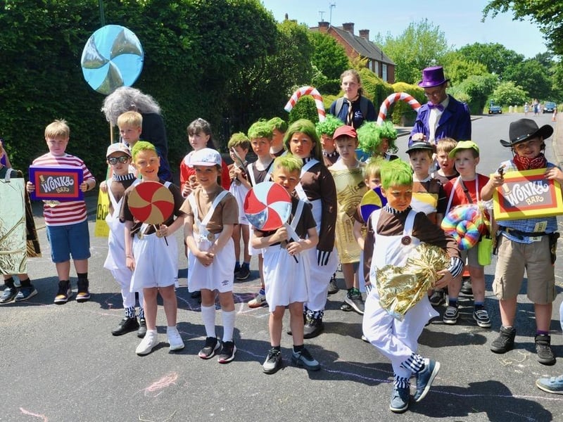 The floats and walking groups proceeded through the village in colourful and imaginative costumes with crowds of spectators lining the streets to cheer them on