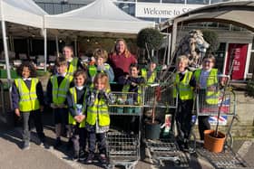 Ditchling School children collect their donation from South Downs Nurseries