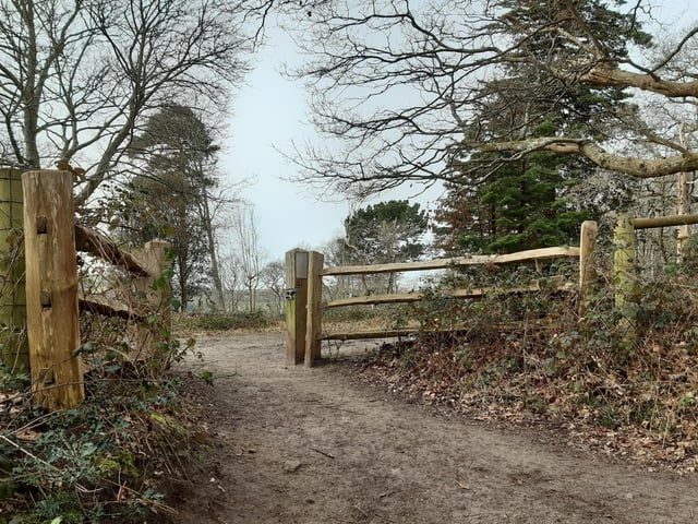 You will find an opening that was once a gate on the left and it is worth going through here...
