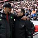 Jurgen Klopp manager of Liverpool with Roberto De Zerbi manager of Brighton and Hove Albion before the Premier League match at Anfield