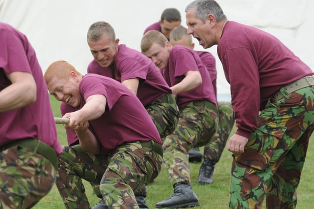 'Put your back into it'... the Royal Artillery team facing defeat at tug-of-war