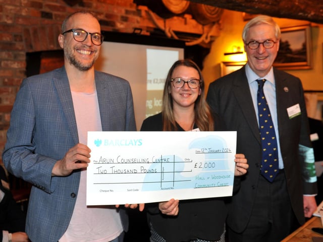 Judge Bex Bastable and family director Mark Woodhouse present a cheque for £2,000 to Arun Counselling Centre