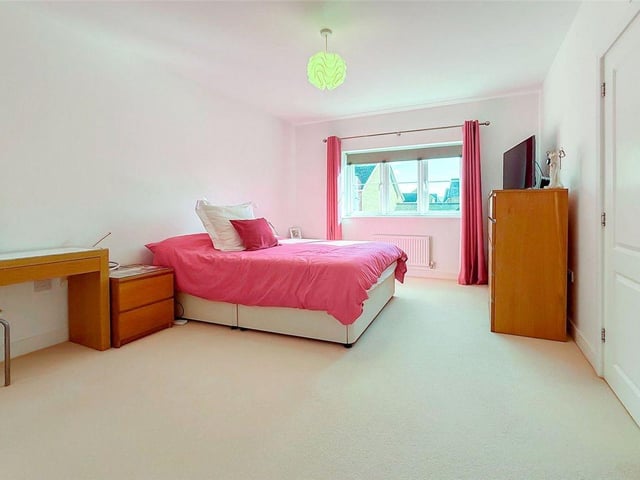 The generous main bedroom has its own en-suite shower room