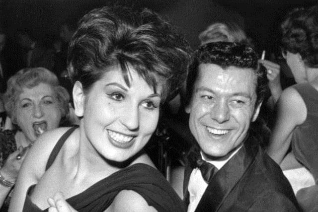 The 1950s recording artist Alma Cogan lived with her parents above their shop in Warwick Street, Worthing, then moved to a large house on the corner of Lansdowne Road and Downview Road in West Worthing. She is pictured here with Lionel Blair, who unveiled a blue plaque in her memory in 2017. One of the biggest stars of the pre-rock era, she sadly died of ovarian cancer aged 34 in October 1966.