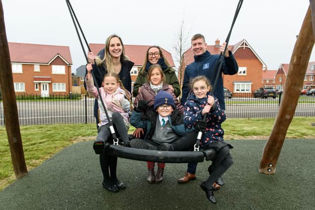 Kilnwood Vale Primary School house captains Buzby, Ola, Lydia and Catherine with Laura Burke from Kilnwood Vale Primary School and Becky Stocker and Alex Hardy from Crest Nicholson at the unveiling of a new play area.