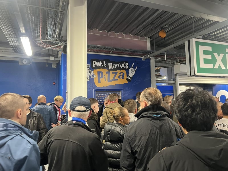 Fans in the stadium ready for the match ahead.